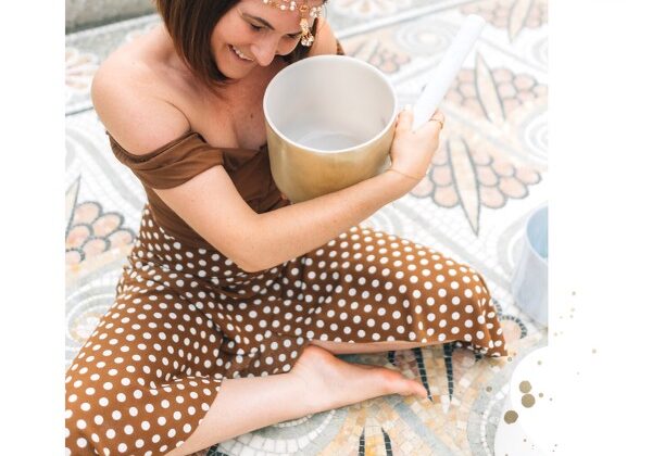 A woman wearing brown dress holding a pot